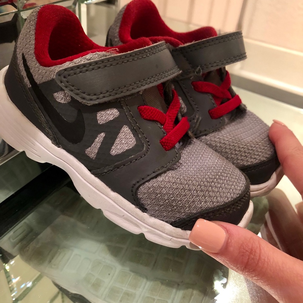 Red and Gray Nike Toddler’s Shoes.